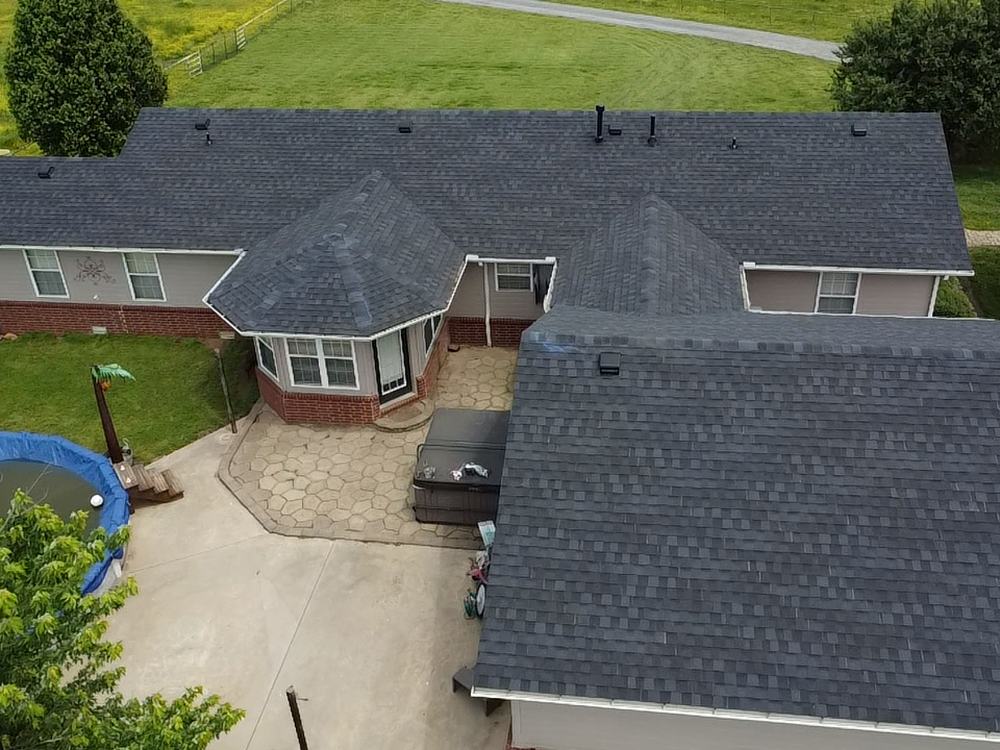 Aerial view of a Tamko Heritage Rustic Black shingle roof replacement in Muskogee, Oklahoma by Diamond B Roofing